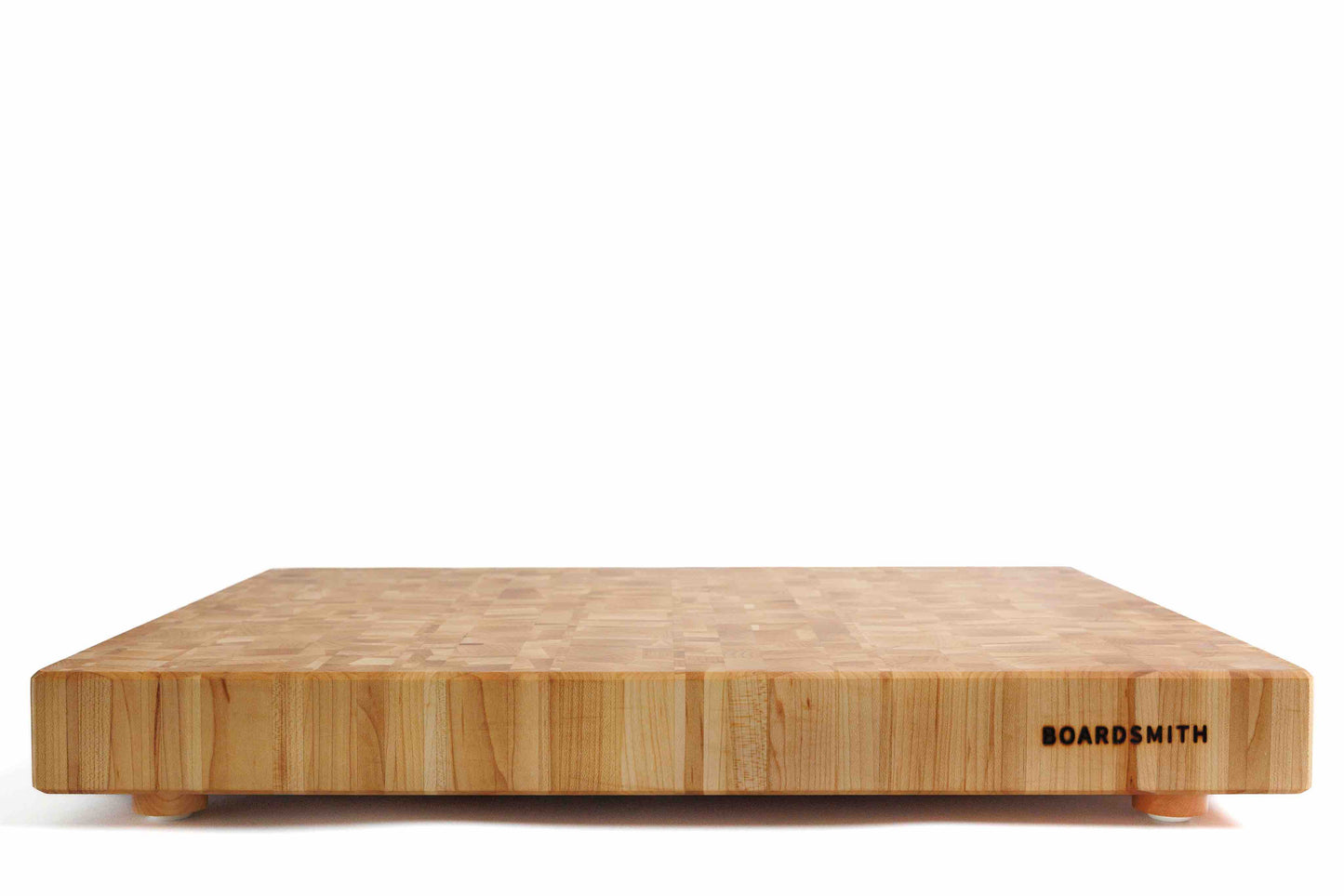 Maple mosaic end grain cutting board with feet by The Boardsmith